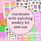 Sticker kit with various designs and text on a pink background