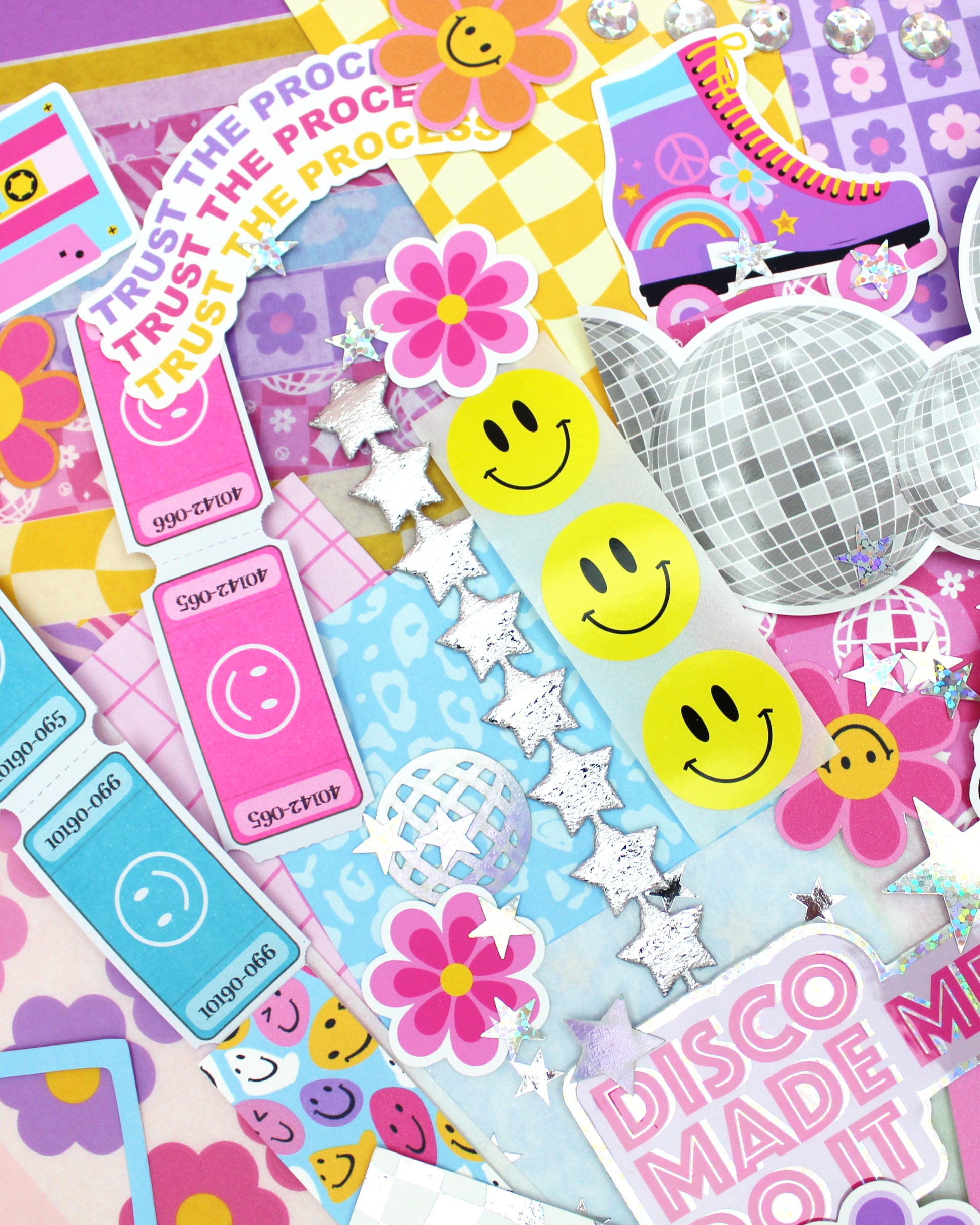 Collection of colorful stickers with smiley faces, flowers, and text on a multicolored background.