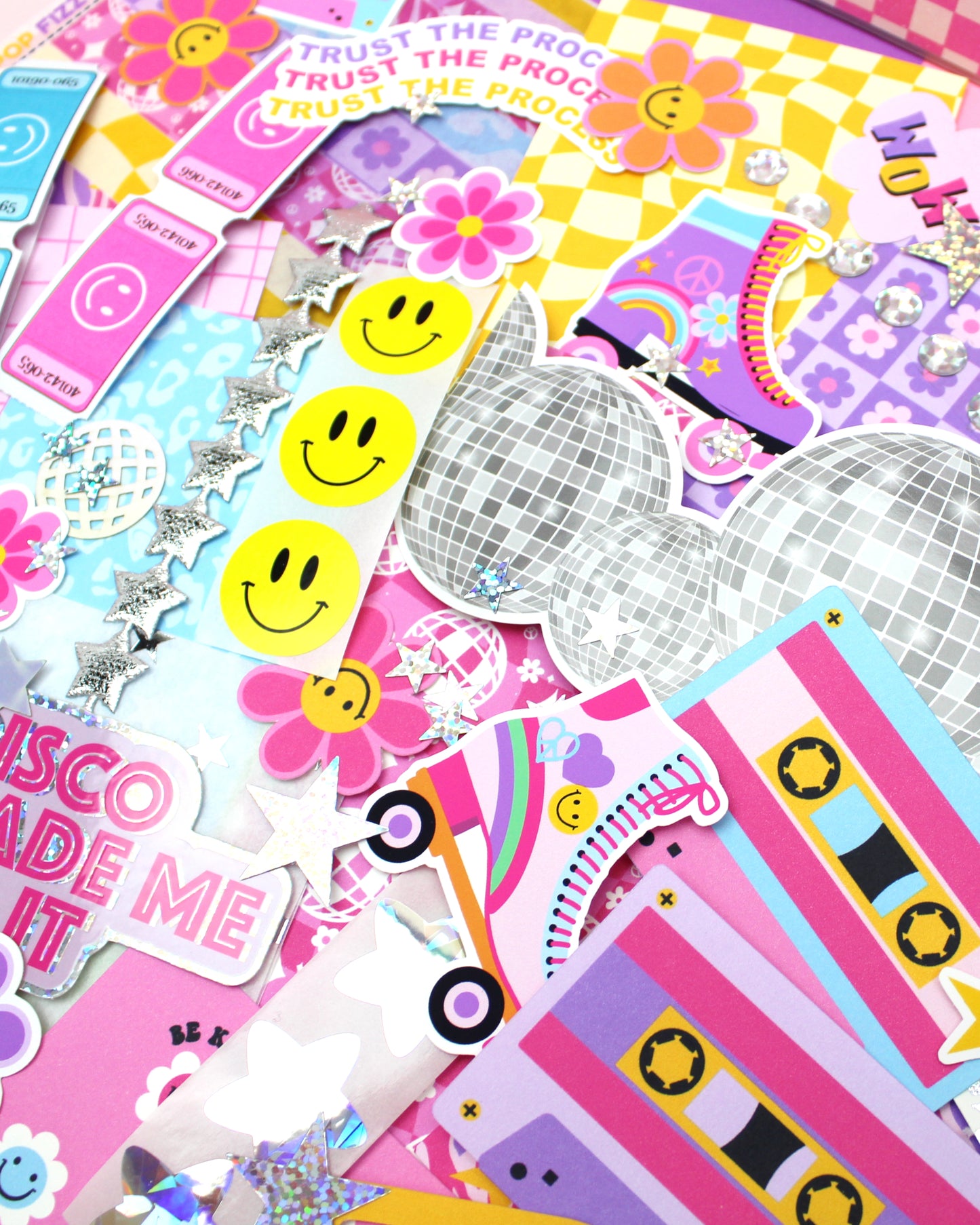 Collection of colorful stickers with disco-themed designs on a pink background