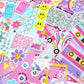 Collection of colorful stickers with disco-themed designs on a pink background