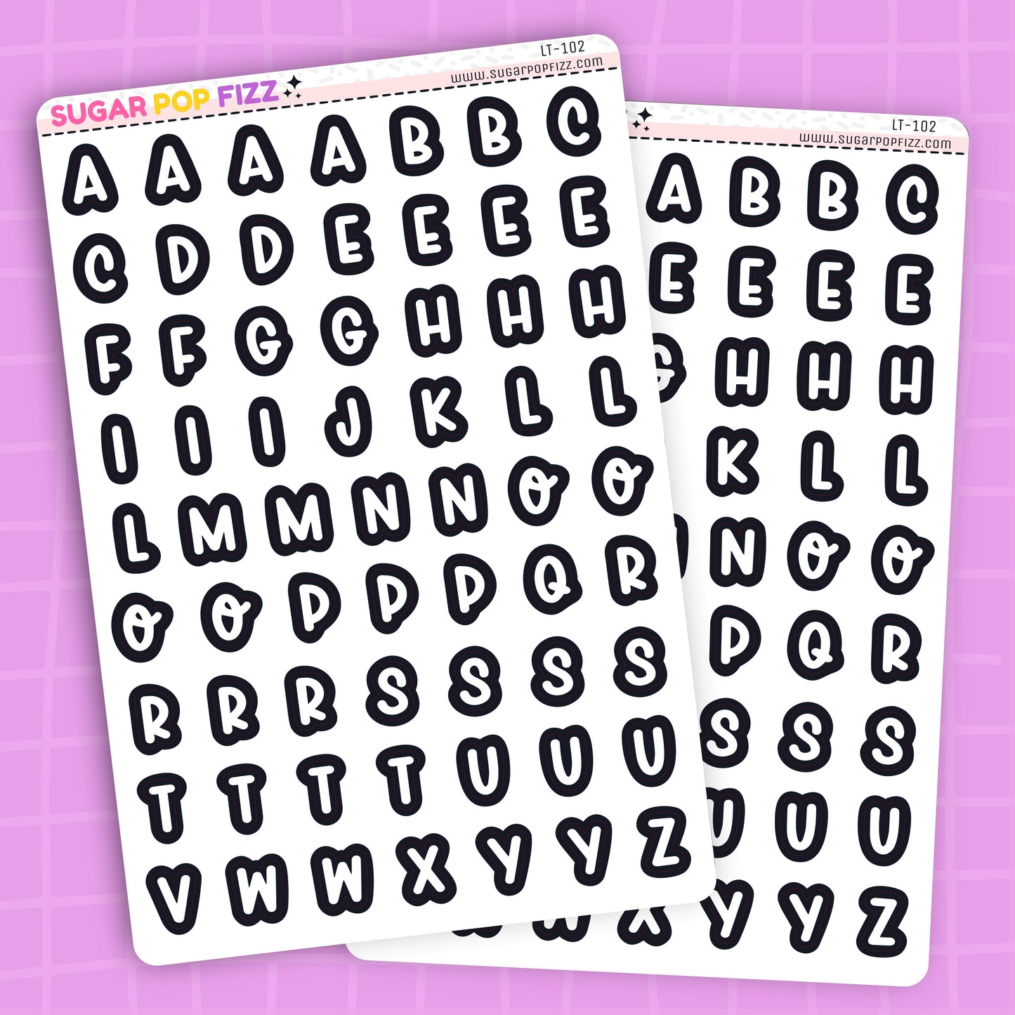 Two sheets of alphabet letter stickers on a purple background