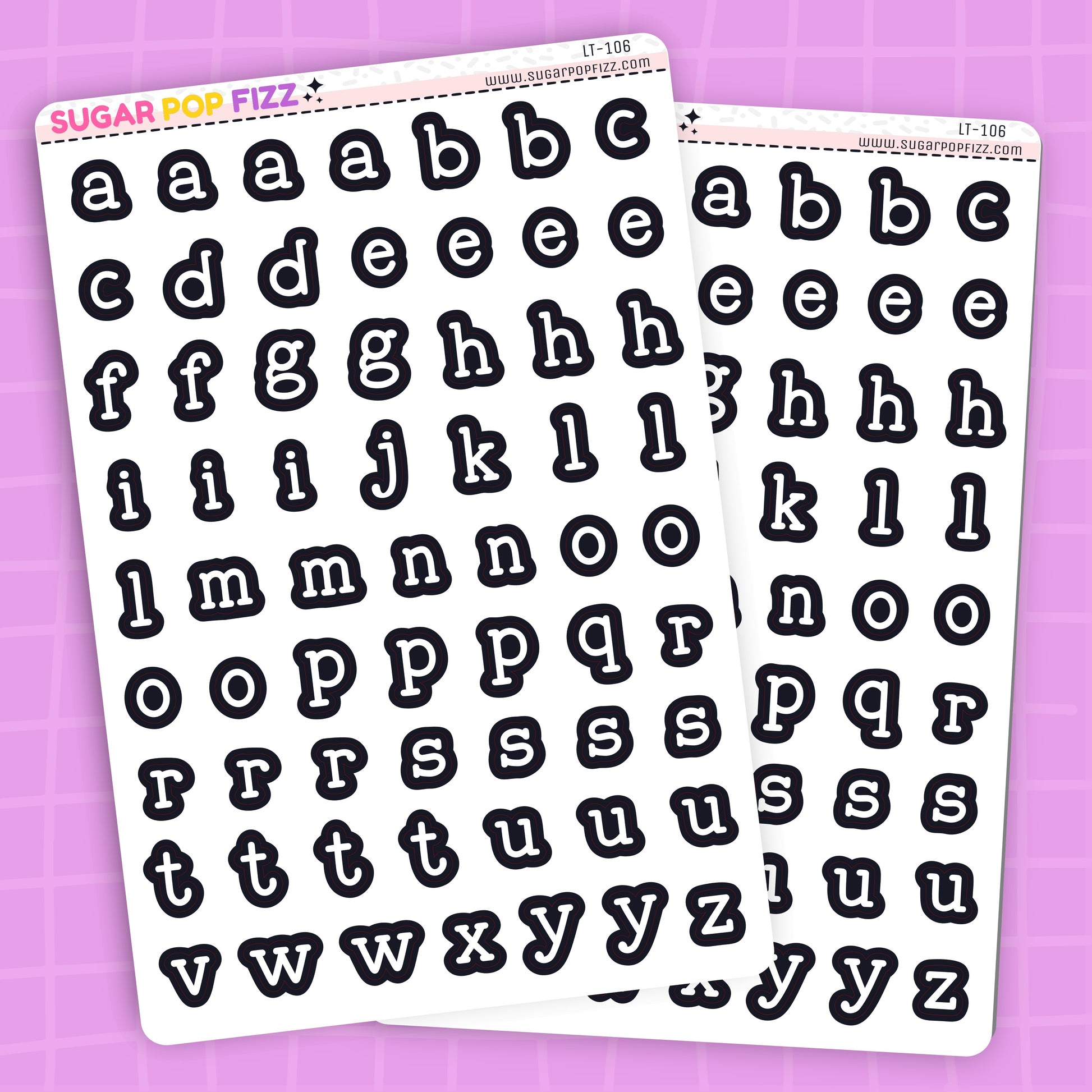 Two sheets of alphabet letter stickers on a purple background