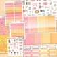 Collection of planner stickers with various designs on a wooden surface.