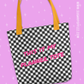 Checkered tote bag with 'This is my planner tote' text on a purple background