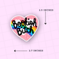 Heart-shaped sticker with 'Bookish Bitch' text on a pink background