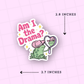 Sticker with a frog holding a mirror and text 'Am I the Drama?' on a pink background.