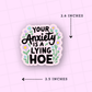 Sticker with text 'Your Anxiety is a Lying Hoe' on a pink background