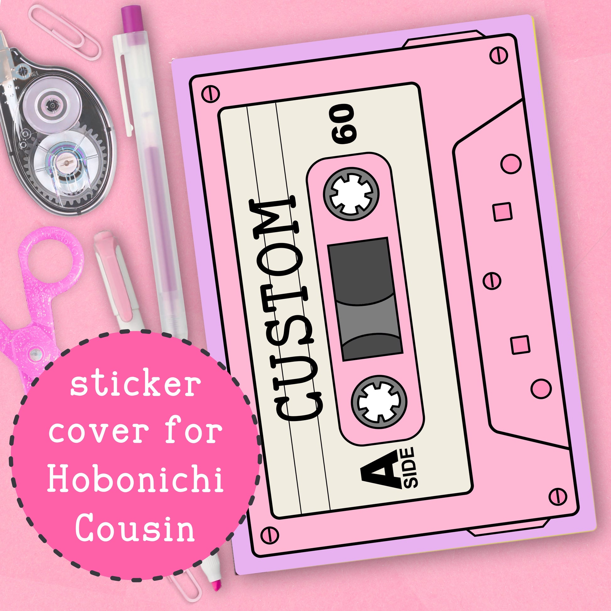 Pink cassette tape-shaped sticker cover for Hobonichi Cousin on a pink background with stationery items.