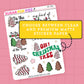 Sheet of Christmas-themed stickers with text on a pink background