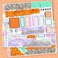 Sticker sheet with various designs and text on a beige background