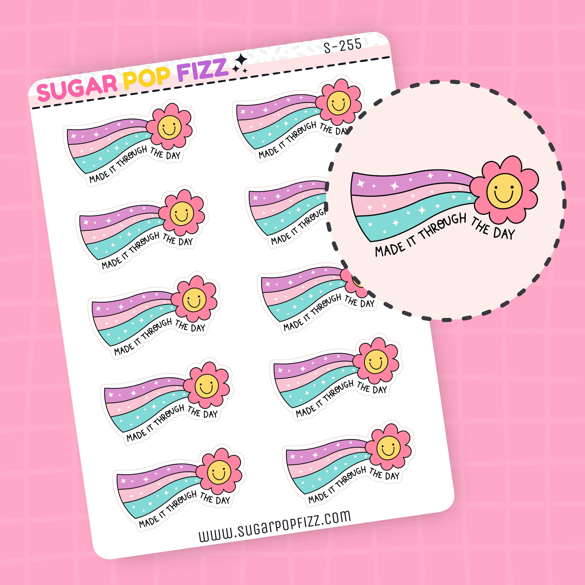 Sticker sheet with rainbow-themed designs and flowers and text that says "made it through the day" on a pink background
