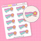 Sticker sheet with rainbow-themed designs and flowers and text that says "made it through the month" on a pink background
