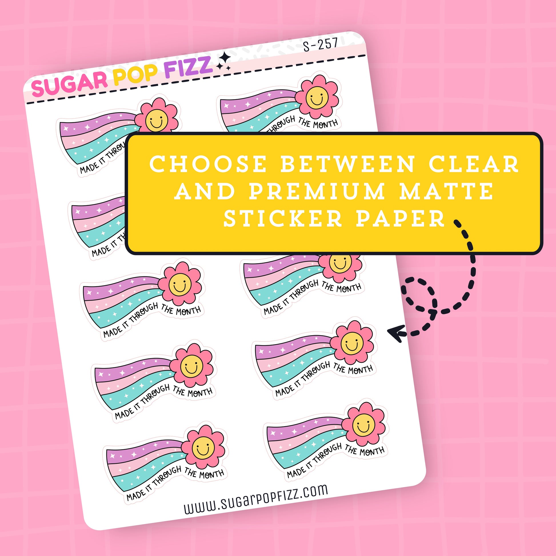 Sheet of planner stickers rainbow-themed designs and flowers and text that says "made it through the month" on a pink background, featuring text about sticker paper options.
