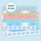 Set of colorful washi strips themed around the movie in blues, pink and yellowson a sticker sheet on a pink background with 'washi strips' text.